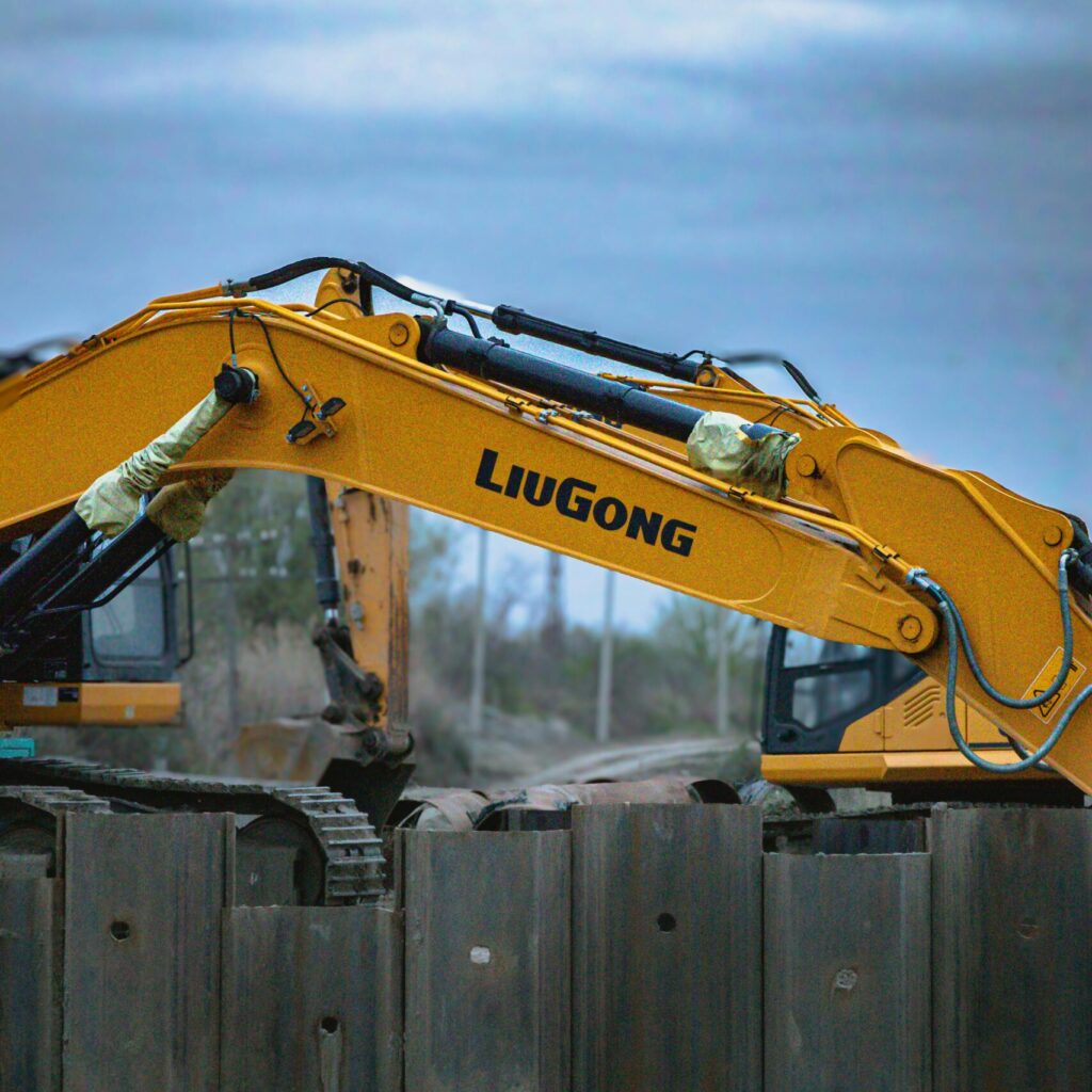 Two yellow LiuGong excavators working at a construction site in Salyan, Azerbaijan.